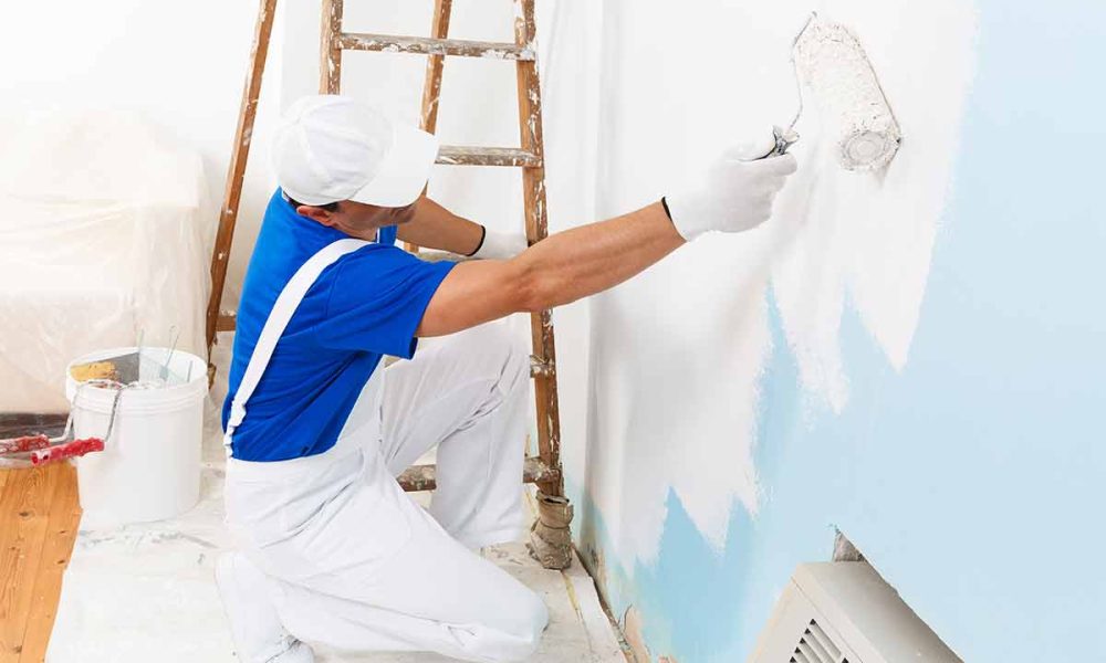 professional-painter-using-water-based-paint-to-paint-wall